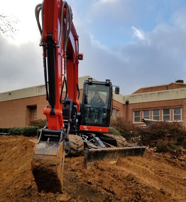 Doing work with an excavator on a Commercial site